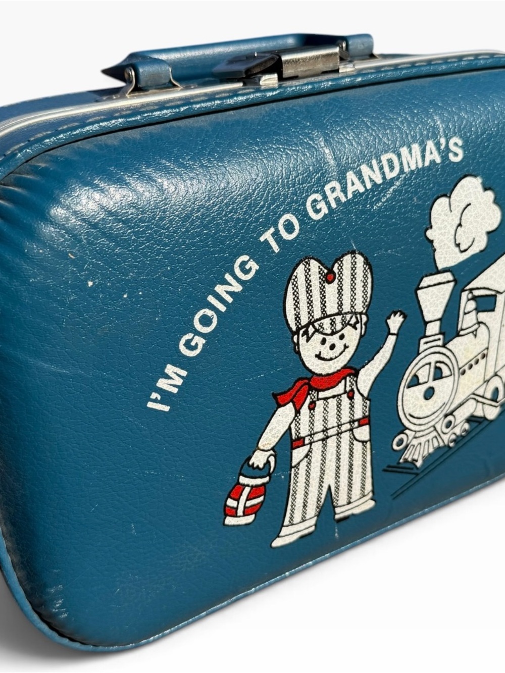 Vintage 1970s Little Boy’s Blue Travel Suitcase featuring a Train